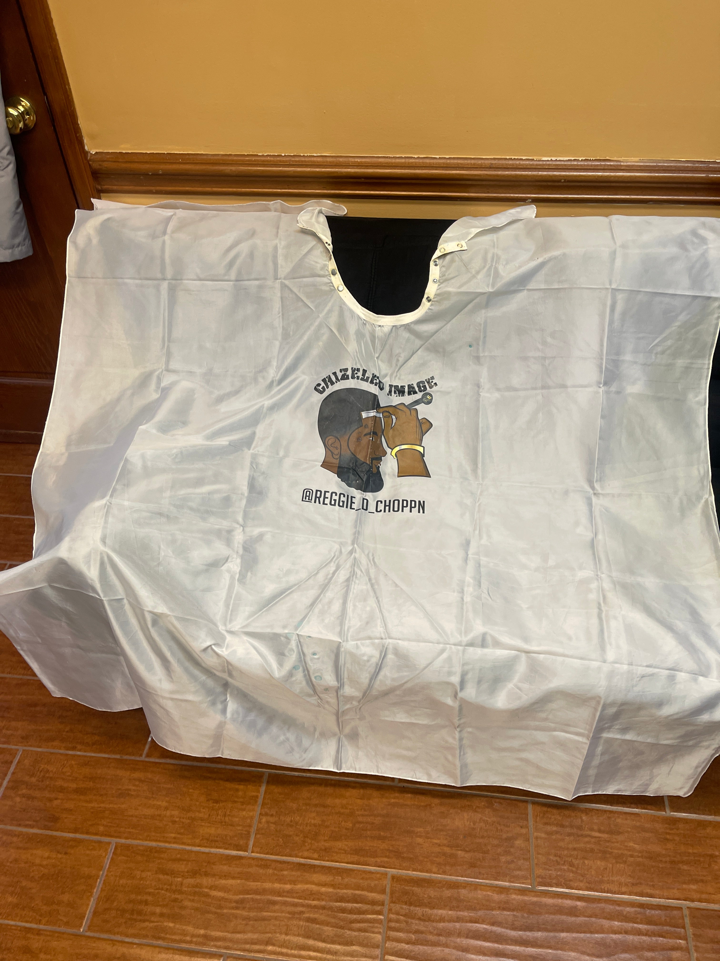 Barber cape, Male logo